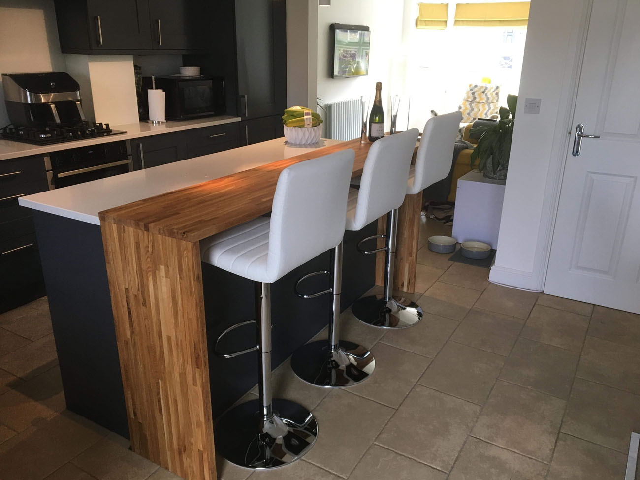 Image of a wooden bar top fitted in a kitchen.